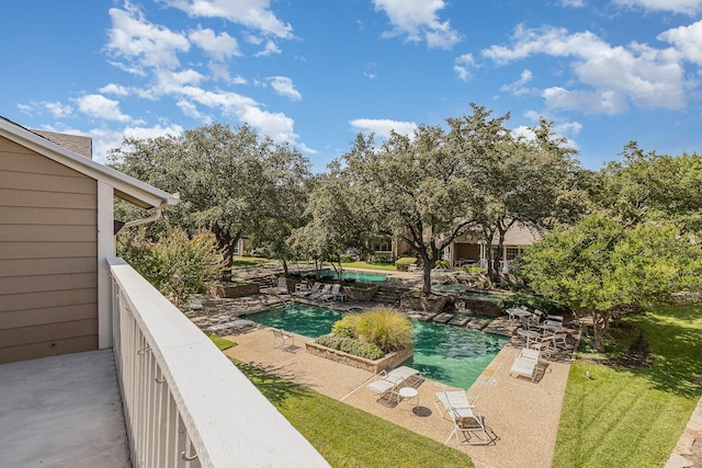 view of swimming pool with a patio