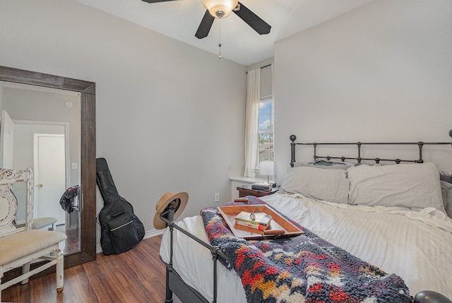 bedroom featuring lofted ceiling, ceiling fan, and dark hardwood / wood-style floors