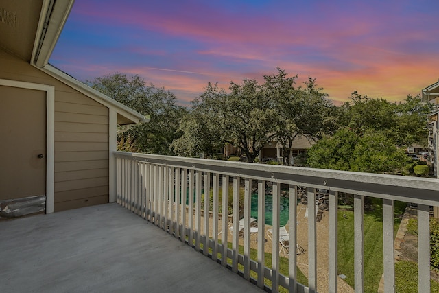 view of balcony at dusk