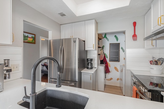 kitchen with sink, white cabinetry, and stainless steel appliances