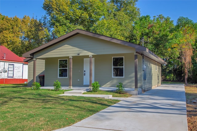 bungalow-style home with a porch and a front yard