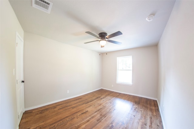 spare room featuring ceiling fan and hardwood / wood-style floors