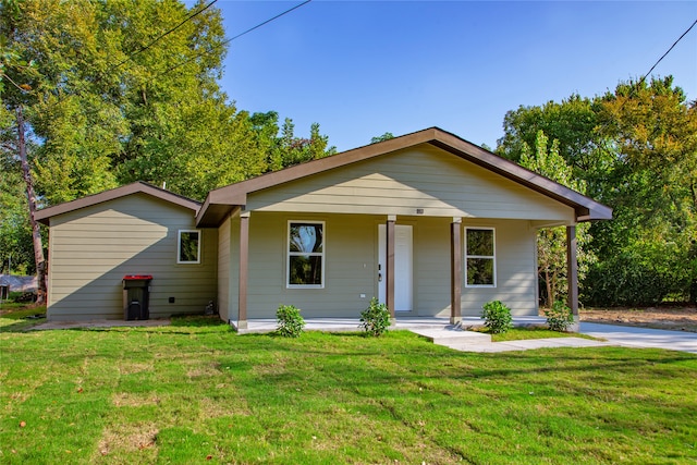 view of front of home with a front yard and covered porch