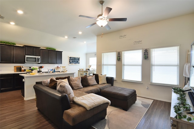 living room featuring light wood-type flooring and ceiling fan