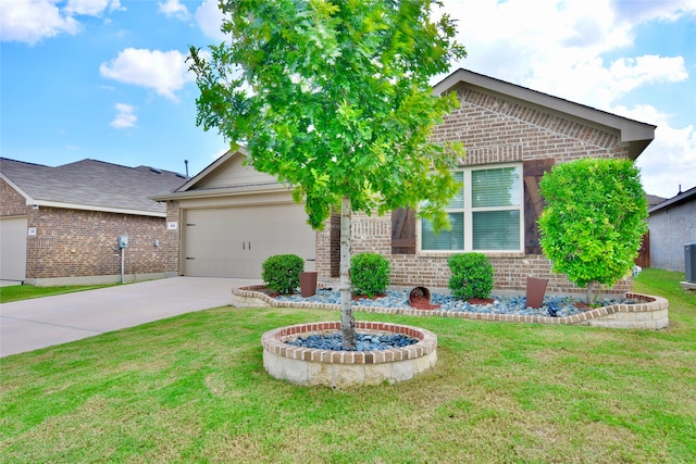 view of front of property with a garage and a front lawn