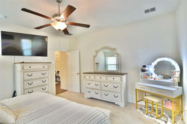 bedroom with ceiling fan and light carpet