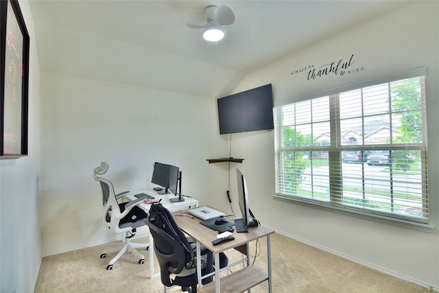 home office with a wealth of natural light, carpet flooring, ceiling fan, and lofted ceiling