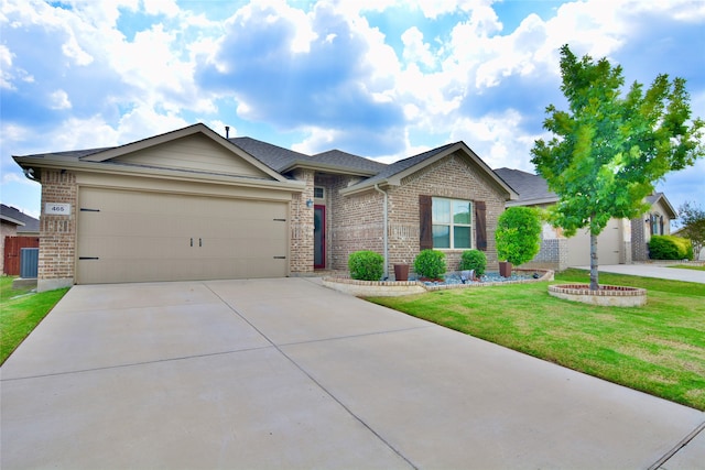 view of front of property with a front lawn and a garage