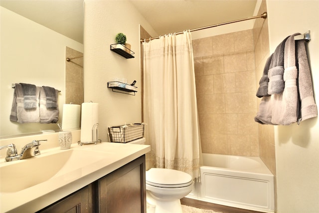 full bathroom featuring vanity, toilet, and shower / bath combination with curtain