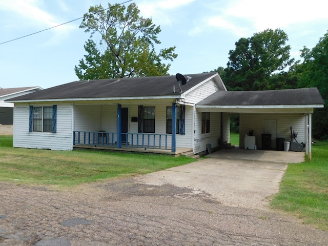 ranch-style home with a porch, a carport, and a front lawn