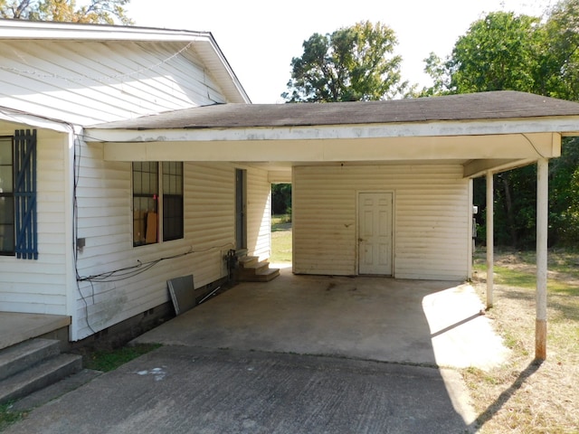 view of front of property featuring a carport