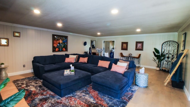 living room with hardwood / wood-style floors and ornamental molding