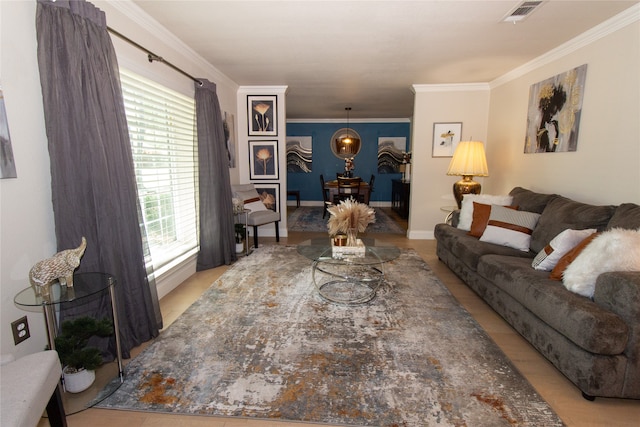 living room featuring light tile patterned floors and ornamental molding