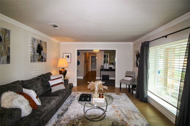 living room featuring crown molding and wood-type flooring