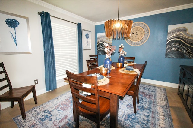 dining room featuring ornamental molding and a notable chandelier