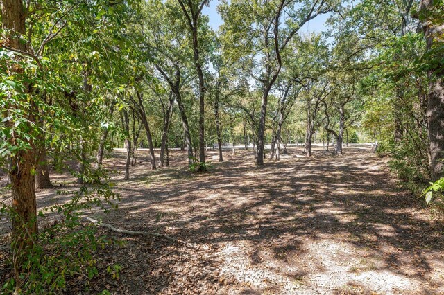 birds eye view of property with a rural view