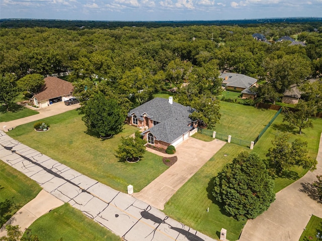 drone / aerial view featuring a forest view