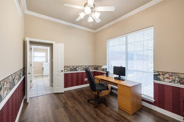 office area with dark wood-type flooring, ceiling fan, and ornamental molding