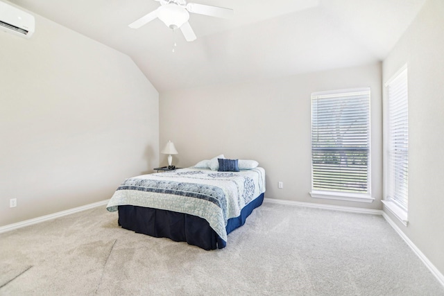bedroom with ceiling fan, carpet, baseboards, lofted ceiling, and a wall unit AC