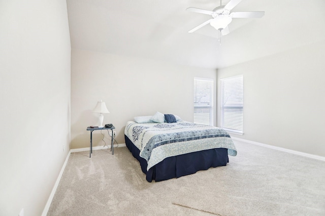 bedroom with ceiling fan, carpet floors, and baseboards