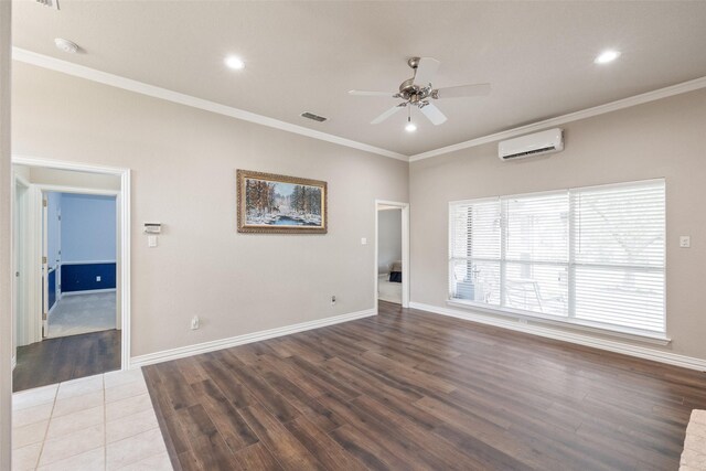 spare room with an AC wall unit, ceiling fan, dark wood-type flooring, and ornamental molding