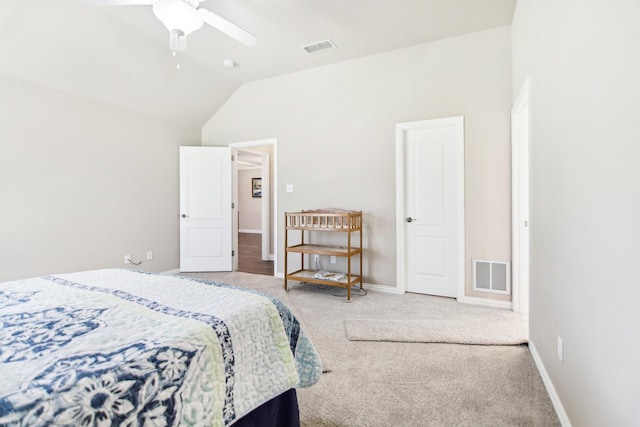 carpeted bedroom with baseboards, vaulted ceiling, visible vents, and a ceiling fan