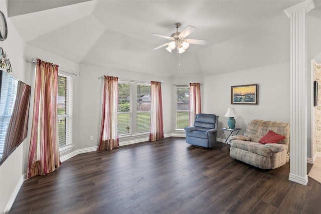 sitting room featuring dark hardwood / wood-style floors, ornate columns, ceiling fan, and lofted ceiling