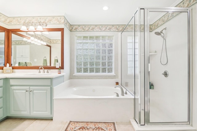 full bathroom with a bath, vanity, tile patterned flooring, and a shower stall