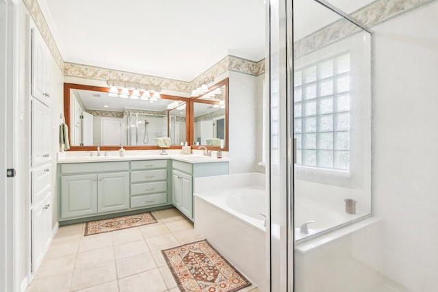 bathroom featuring a bath, tile patterned floors, vanity, and a stall shower