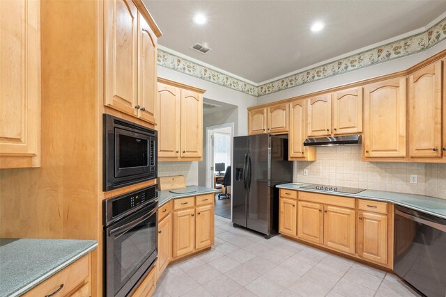 kitchen with decorative backsplash, light brown cabinetry, and black appliances