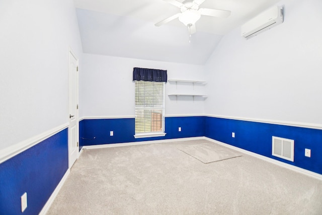 carpeted spare room with baseboards, vaulted ceiling, visible vents, and an AC wall unit