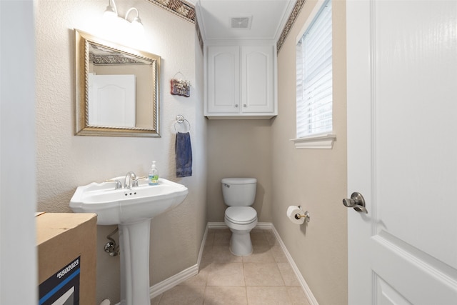 bathroom featuring sink, tile patterned flooring, and toilet