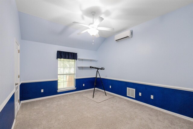 spare room with carpet, a wall mounted AC, lofted ceiling, and ceiling fan