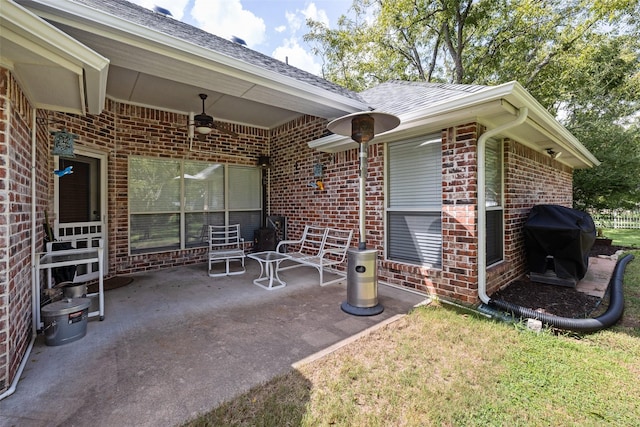 view of patio featuring area for grilling and ceiling fan