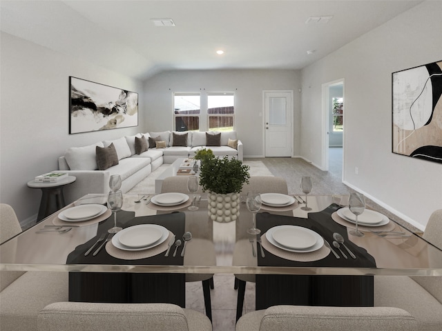 dining space featuring lofted ceiling