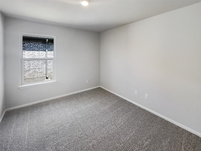 unfurnished room featuring carpet