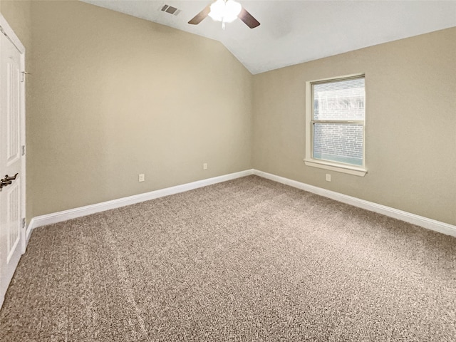 unfurnished room featuring carpet flooring, ceiling fan, and vaulted ceiling