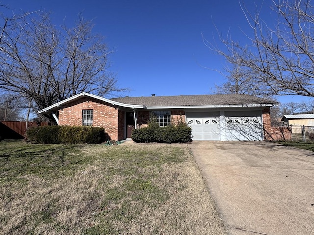 single story home featuring a front lawn and a garage