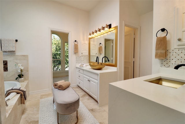 bathroom with a bathing tub and vanity