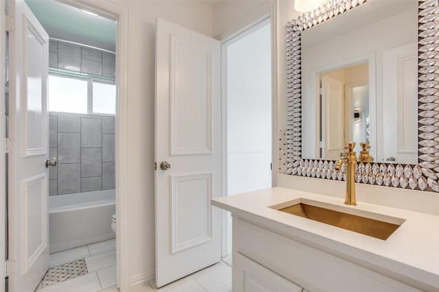 bathroom featuring tile patterned floors, vanity, and toilet