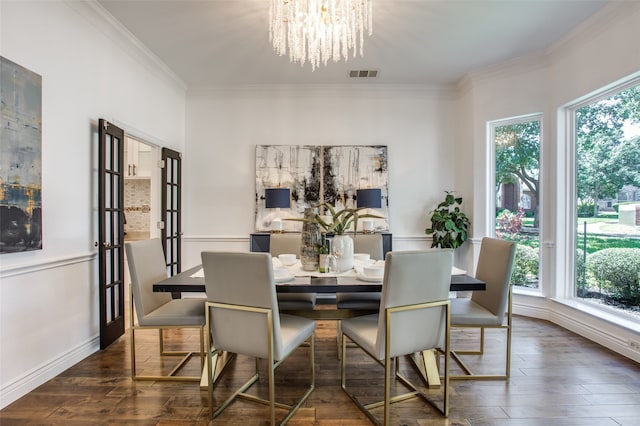 dining room with crown molding, dark wood-type flooring, and a healthy amount of sunlight