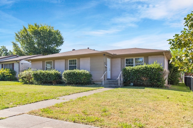 ranch-style home featuring a front lawn