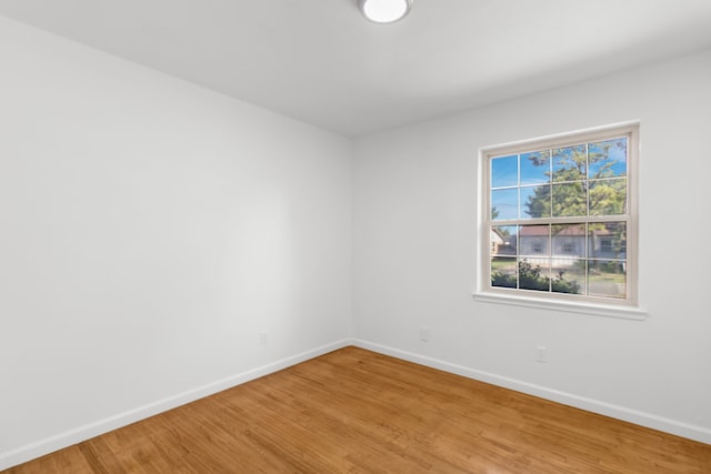 unfurnished room featuring hardwood / wood-style floors