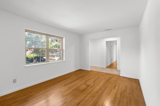 spare room with light wood-type flooring