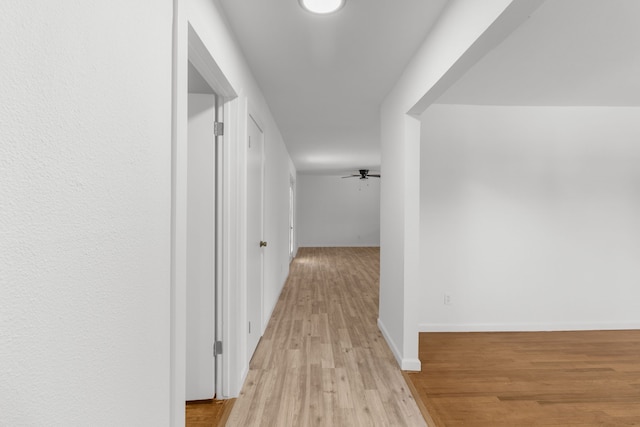 corridor featuring light wood-type flooring