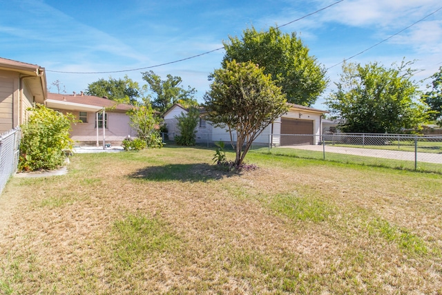 view of yard with a garage