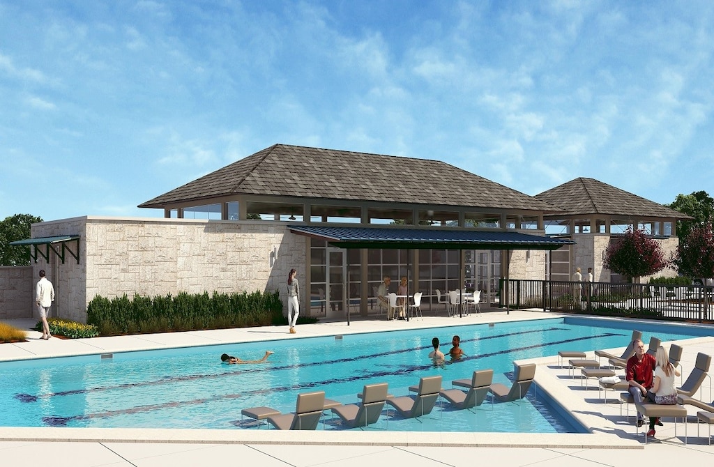 view of swimming pool featuring a patio and a sunroom