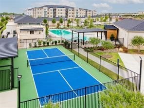 view of sport court featuring a fenced in pool