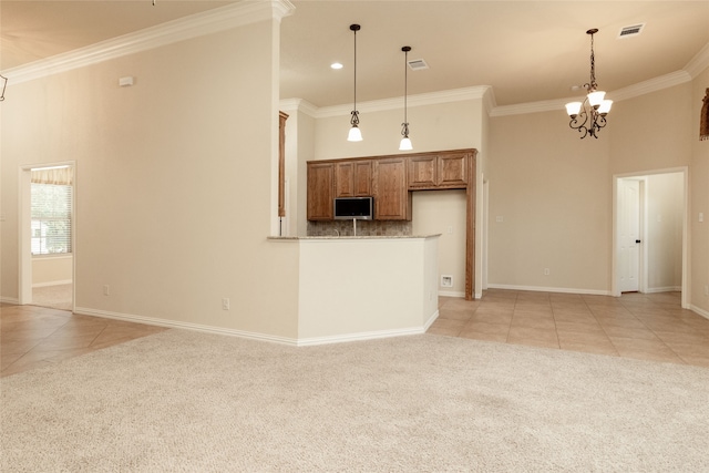 kitchen featuring light colored carpet, pendant lighting, ornamental molding, and a notable chandelier