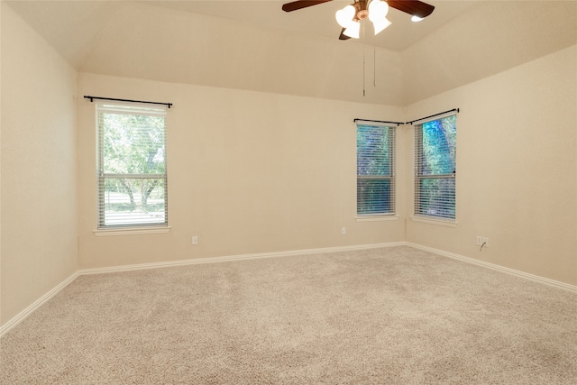 spare room with lofted ceiling, ceiling fan, and carpet floors